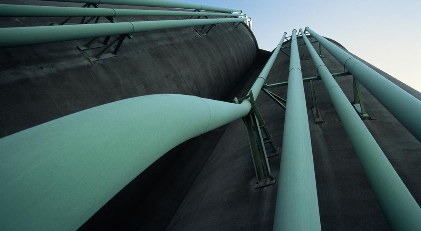 low angle view of parallel green pipes