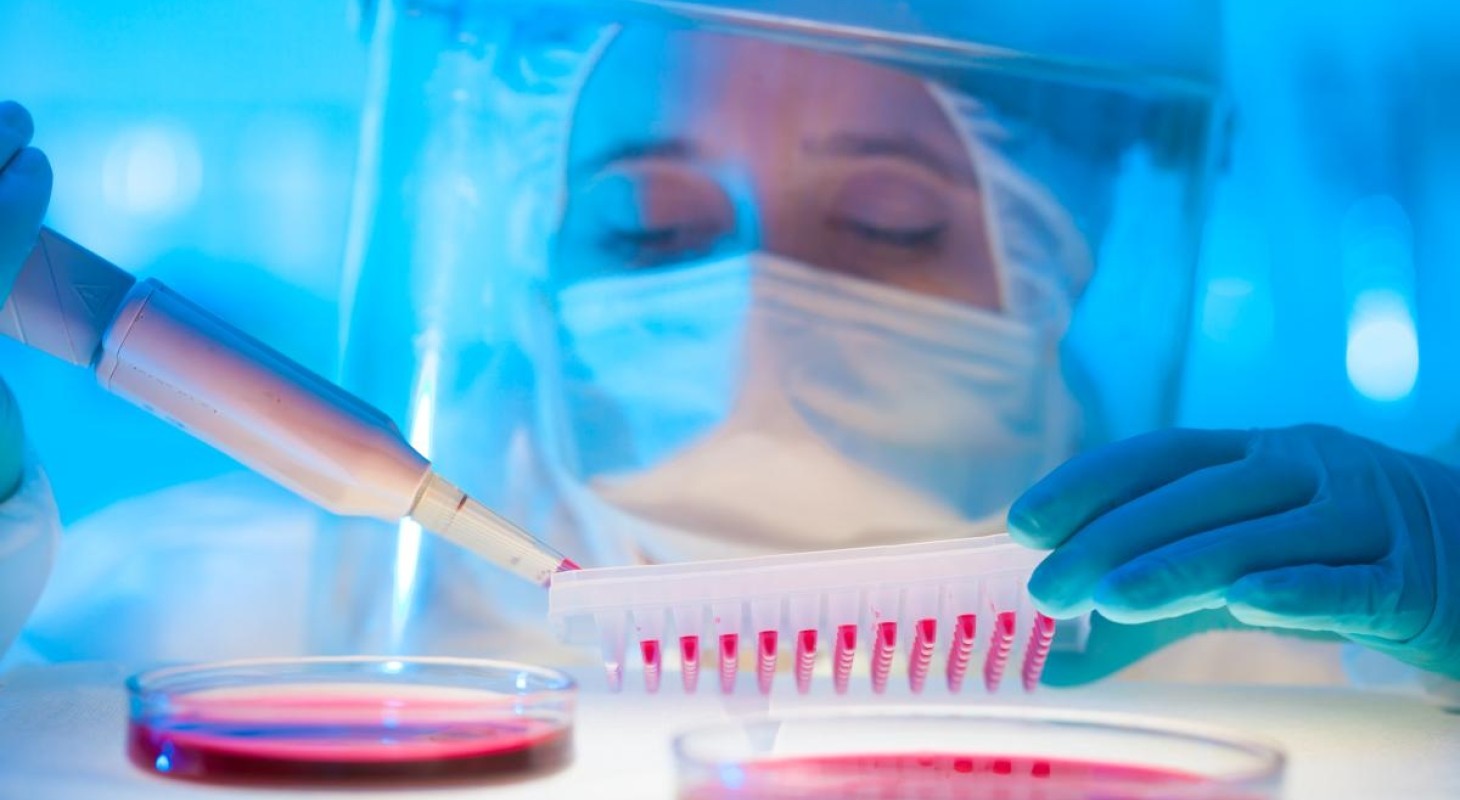 life sciences technician working with petri dishes