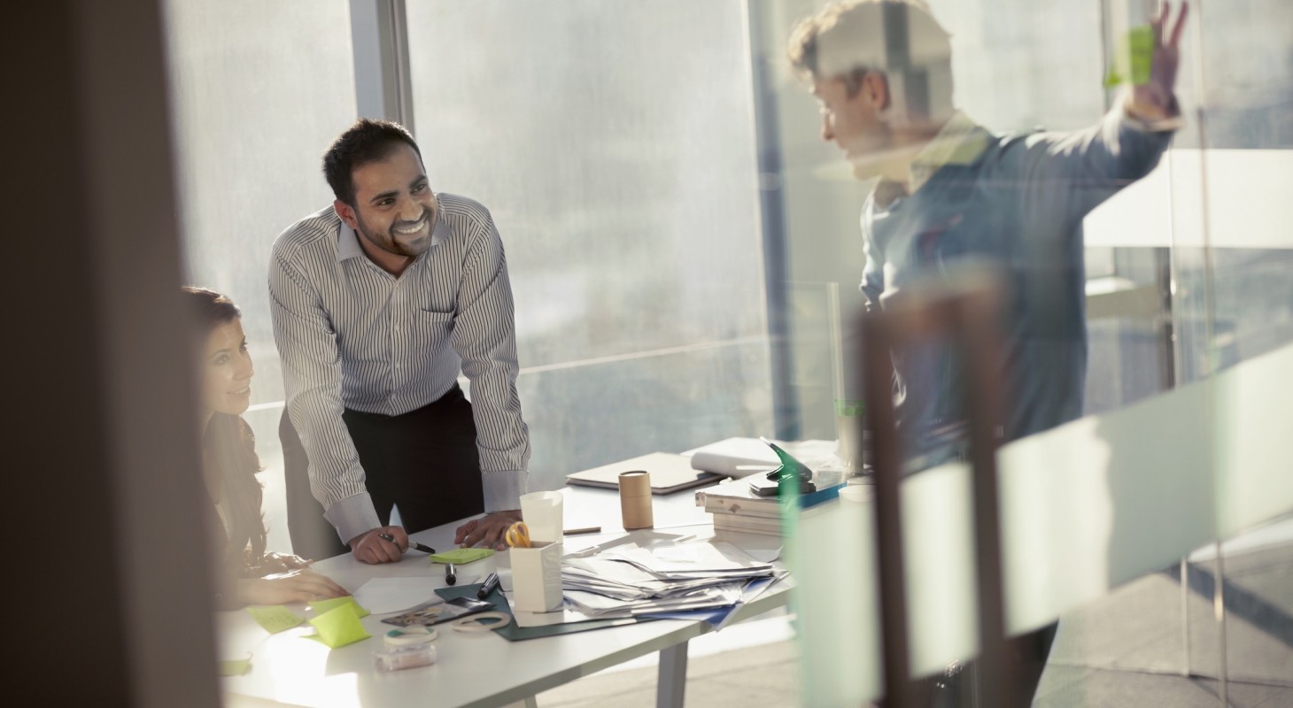 business colleagues smiling in planning meeting 