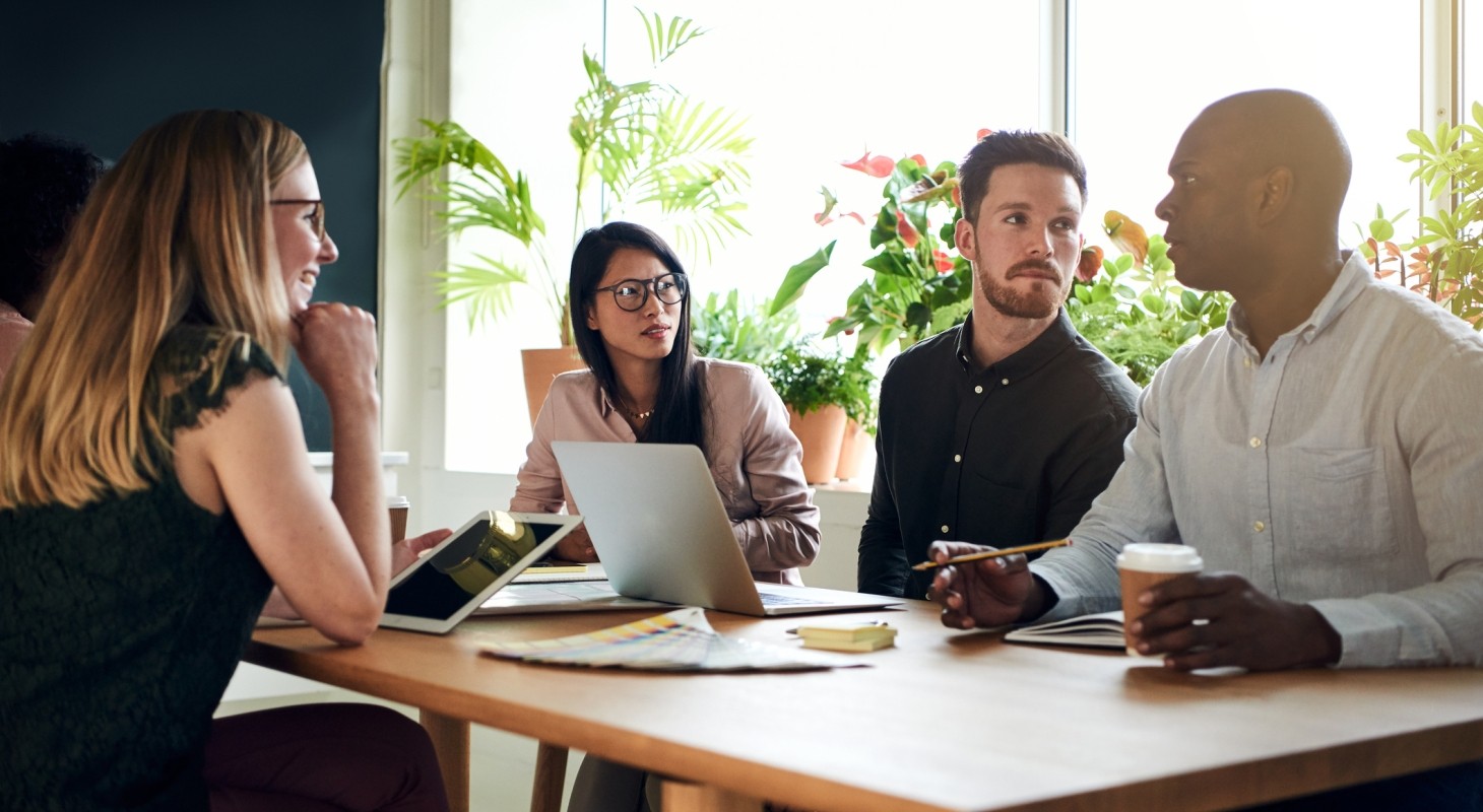 diverse business colleagues having a meeting around a boardroom table