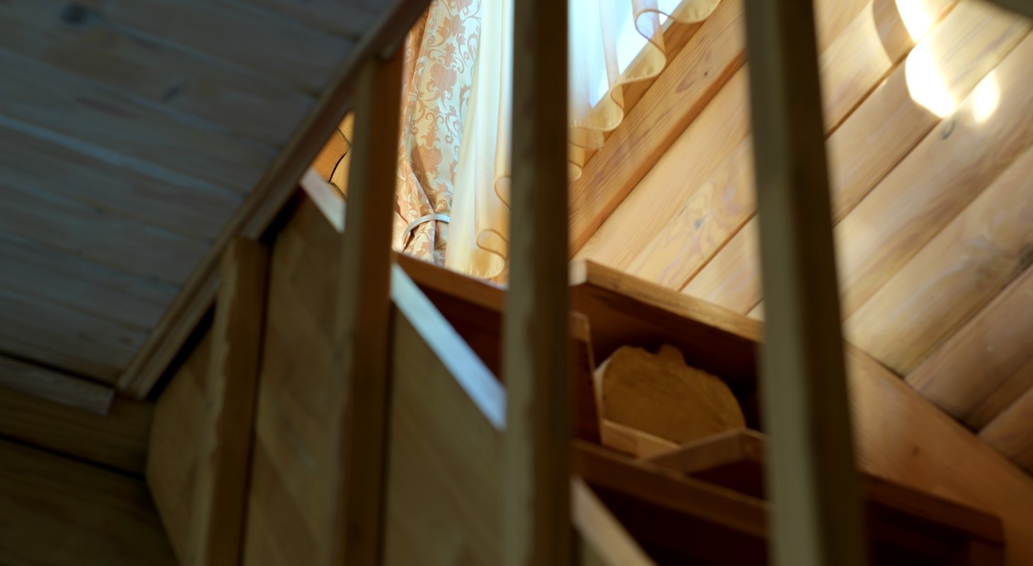 wooden staircase with window light