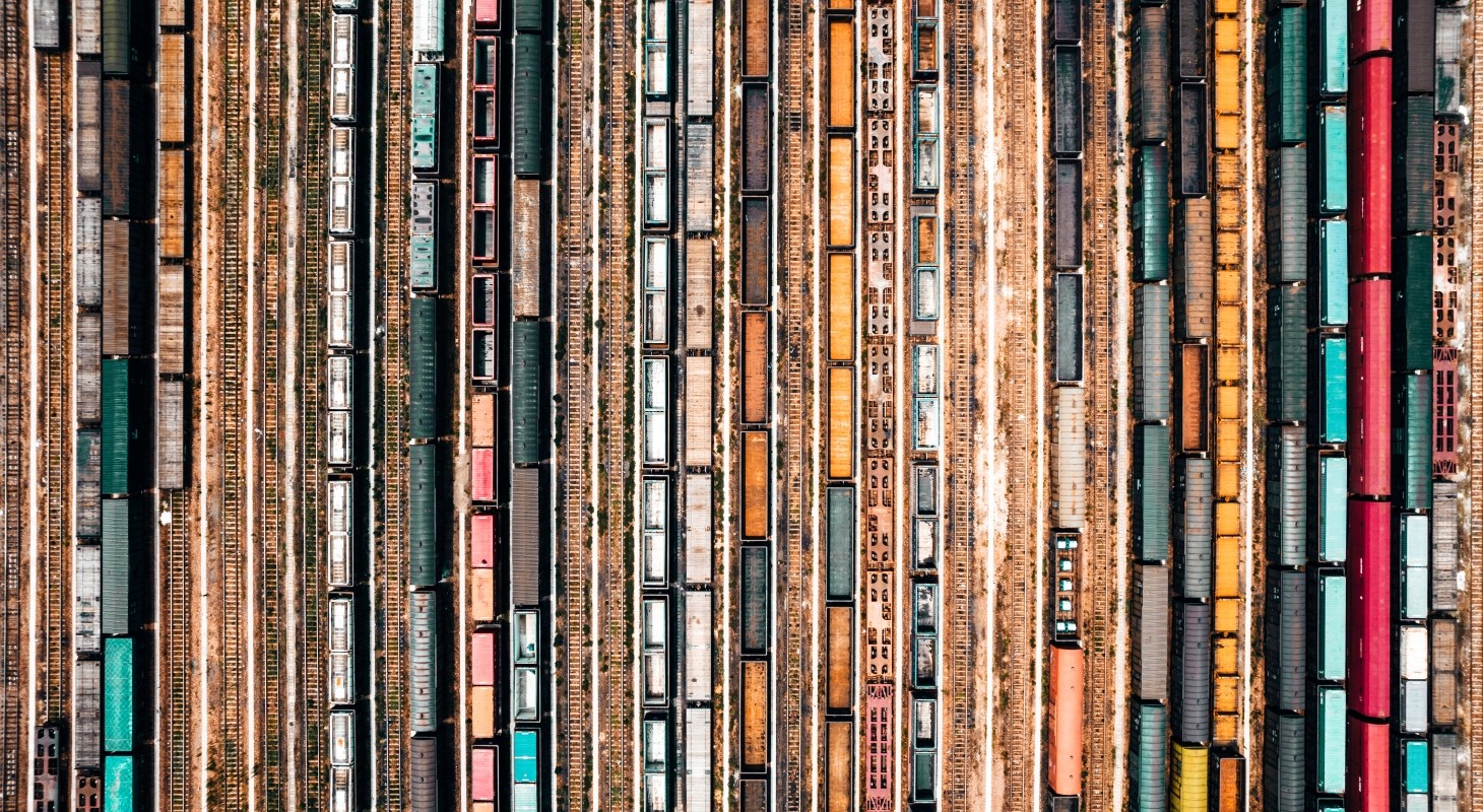 dozens of trains in railyard as viewed from directly above