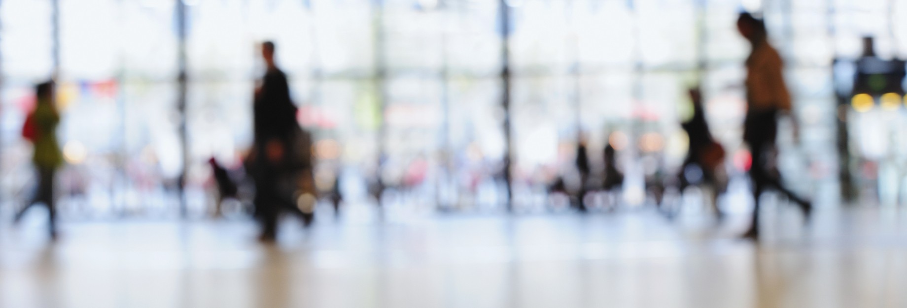 out of focus pedestrians in a modern building