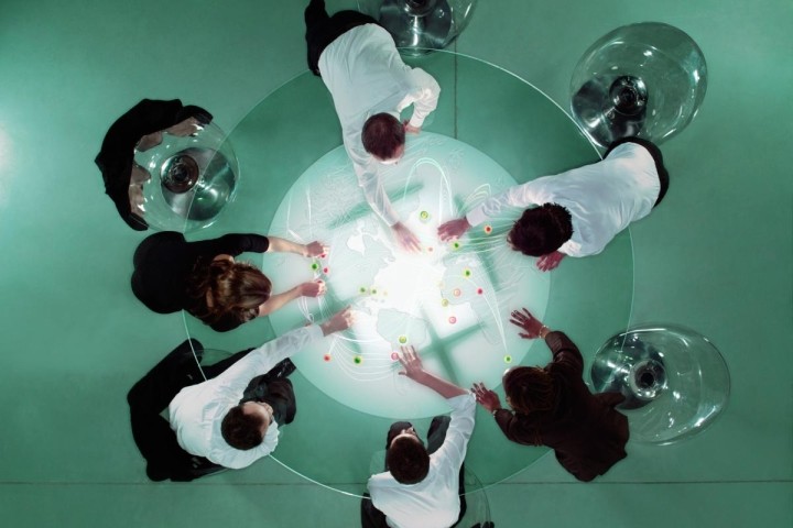 overhead-view-of-business-people-analyzing-map