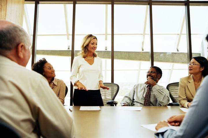 Group-of-professionals-having-meeting-in-boardroom