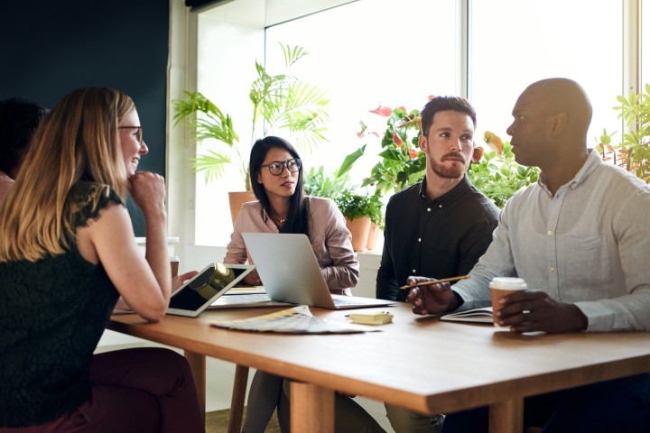 diverse business colleagues having a meeting around a boardroom table