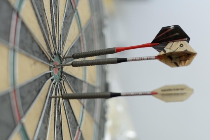 three darts on dartboard