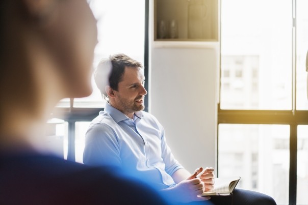 businessman sharing ideas in meeting room