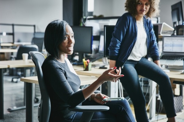 female engineer leading project meeting in high tech office