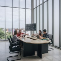 business team having meeting in bright modern conference room