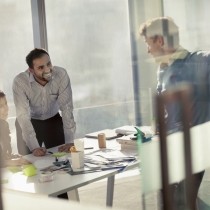 business colleagues smiling in planning meeting 