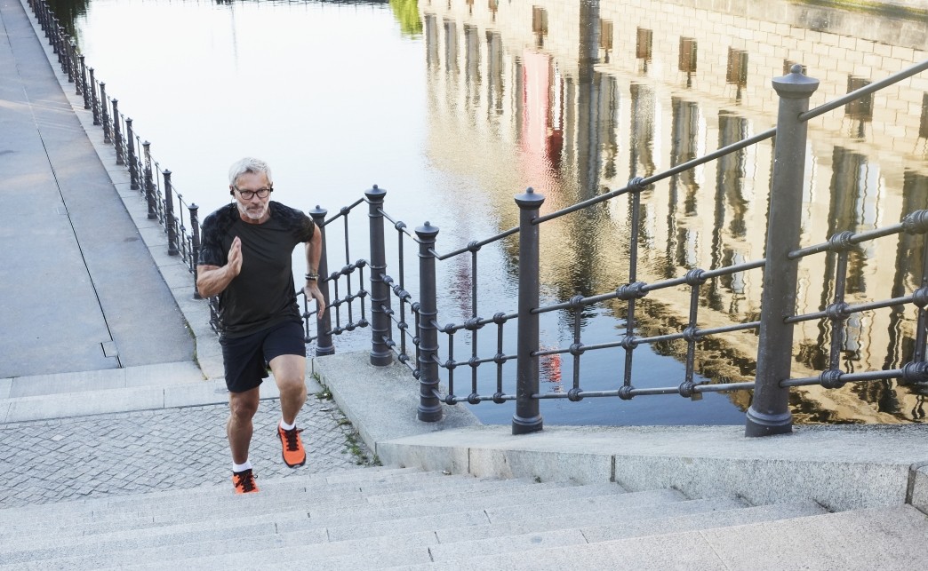 portrait of an active senior man doing exercise in the city of Berlin